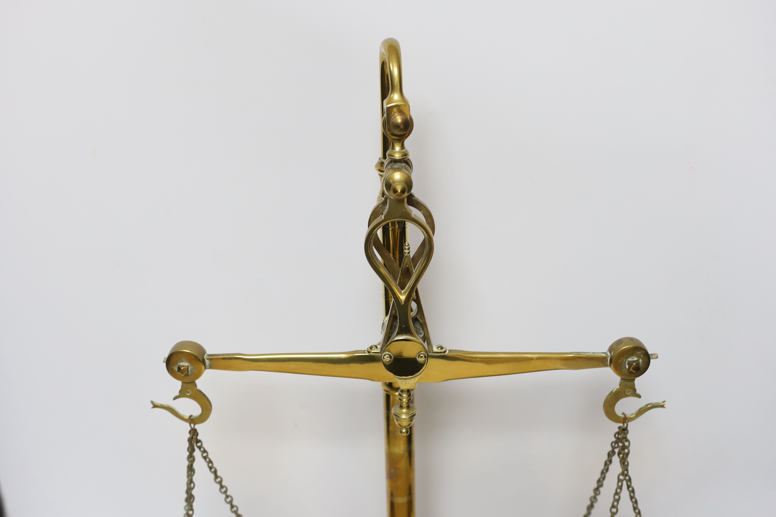 A set of brass kg scales, and integral weights, 55cm high